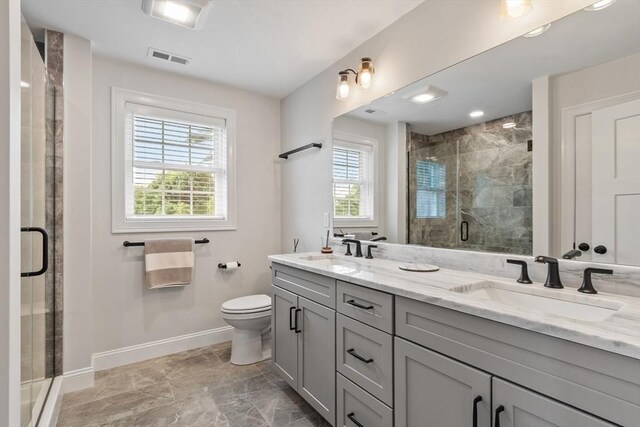 35 Lucaya Cir, Wilmington, MA 01887 - bathroom featuring plenty of natural light, double vanity, baseboards, and a stall shower