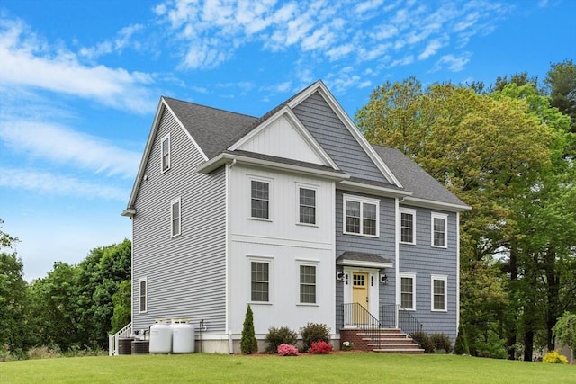 35 Lucaya Cir, Wilmington, MA 01887 - view of front of home featuring a front lawn, roof with shingles, and central AC