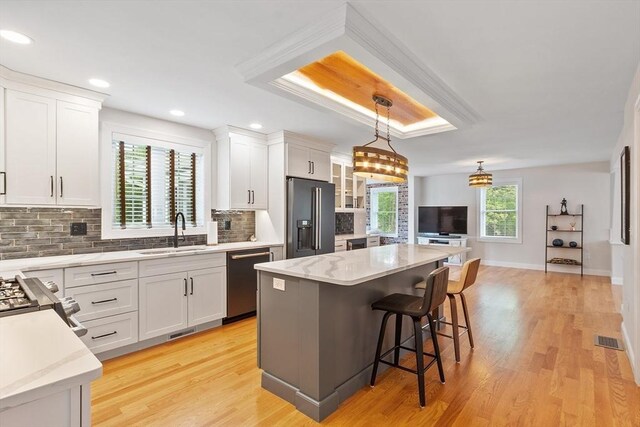 35 Lucaya Cir, Wilmington, MA 01887 - kitchen with high quality fridge, stainless steel dishwasher, a sink, tasteful backsplash, and a kitchen breakfast bar