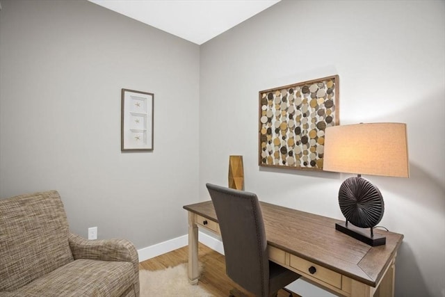 office space with light hardwood / wood-style flooring