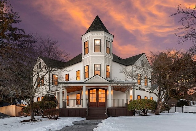 victorian house featuring a porch