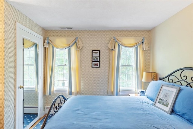 bedroom featuring wallpapered walls