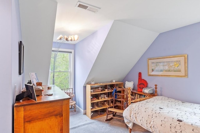 carpeted bedroom with vaulted ceiling