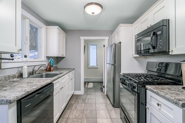 kitchen featuring baseboard heating, sink, white cabinetry, and black appliances