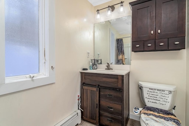 bathroom featuring toilet, baseboard heating, vanity, and walk in shower