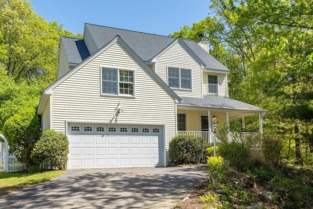 21 Mcdonough Dr, Marlborough, MA 01752 - view of front facade featuring asphalt driveway, a chimney, covered porch, an attached garage, and a shingled roof