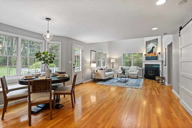 21 Mcdonough Dr, Marlborough, MA 01752 - dining room featuring a barn door, light wood-style floors, baseboards, and recessed lighting