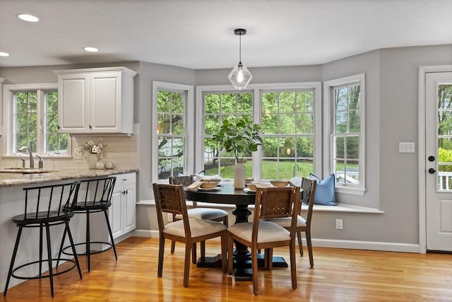 21 Mcdonough Dr, Marlborough, MA 01752 - dining area featuring light wood finished floors, baseboards, and recessed lighting