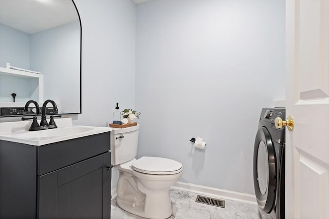 21 Mcdonough Dr, Marlborough, MA 01752 - half bathroom with washer / clothes dryer, baseboards, toilet, and vanity