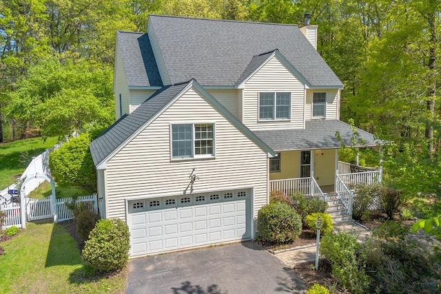 21 Mcdonough Dr, Marlborough, MA 01752 - view of front facade with fence, asphalt driveway, an attached garage, a porch, and a shingled roof