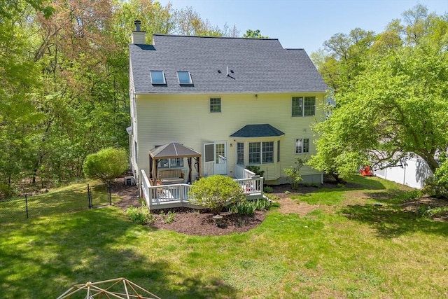21 Mcdonough Dr, Marlborough, MA 01752 - rear view of house featuring a gazebo, a chimney, a deck, and roof with shingles
