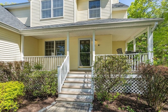 21 Mcdonough Dr, Marlborough, MA 01752 - view of exterior entry with a porch and a shingled roof