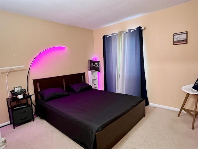 bedroom featuring carpet floors and baseboards