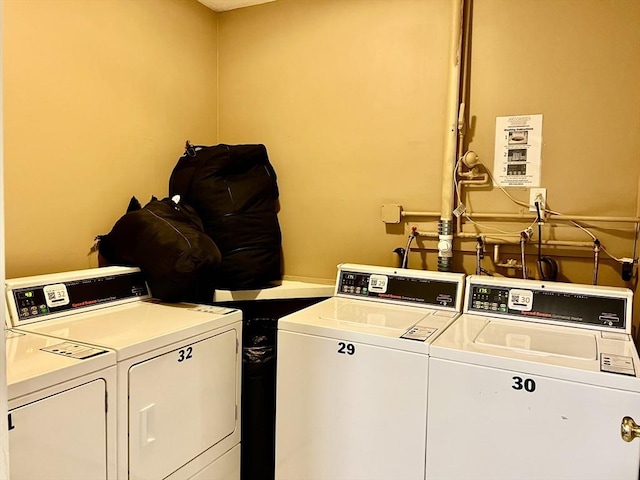 shared laundry area with washing machine and dryer