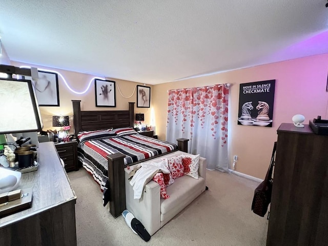 carpeted bedroom featuring baseboards
