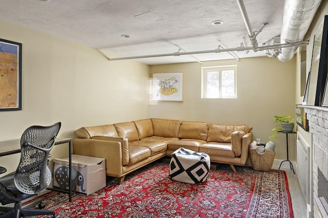 tiled living area featuring a fireplace
