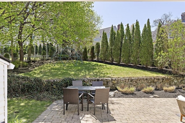 view of patio with fence and outdoor dining area