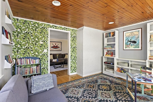 sitting room featuring crown molding, wood ceiling, and wood finished floors