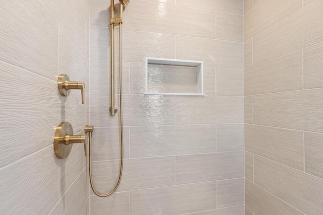 room details with a tile shower