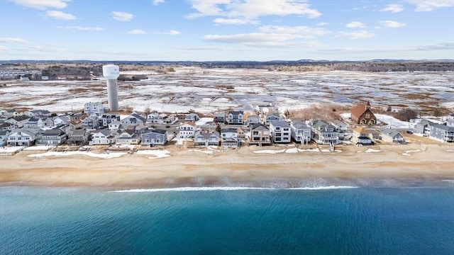 birds eye view of property with a water view, a residential view, and a view of the beach