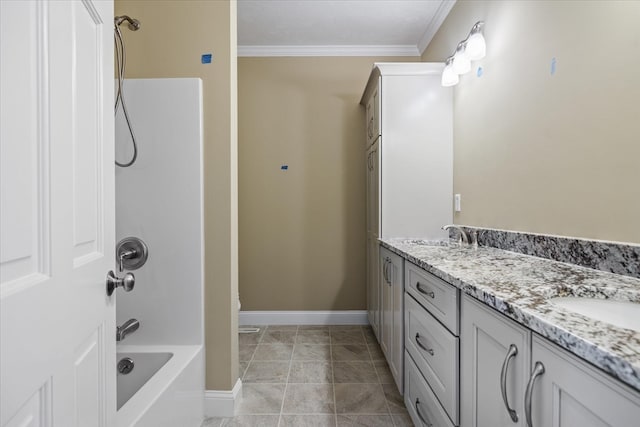 bathroom featuring ornamental molding, tile patterned floors, bathtub / shower combination, and vanity