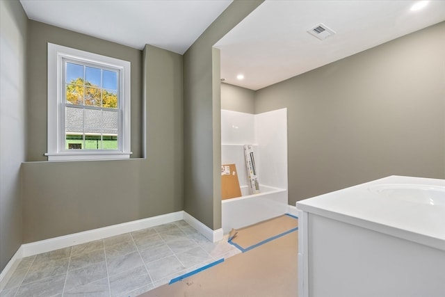 interior space with tile patterned floors and vanity