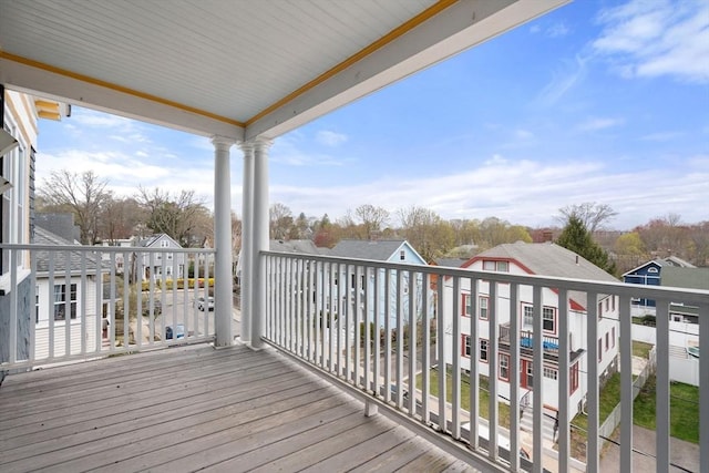 wooden deck with a residential view