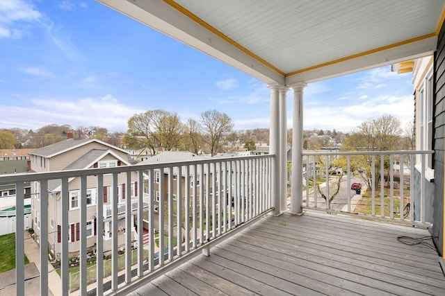wooden deck with a residential view