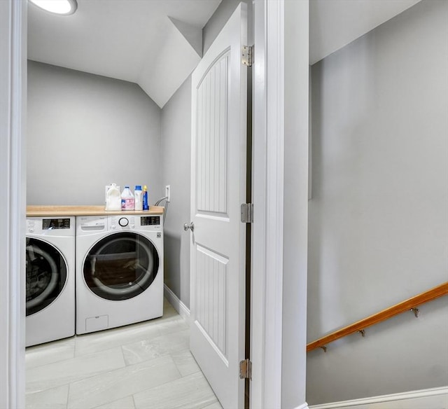 clothes washing area featuring washer and dryer