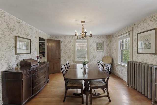 38 Booth Hill Rd, Scituate, MA 02066 - dining room featuring radiator, wallpapered walls, light wood-style floors, and healthy amount of natural light