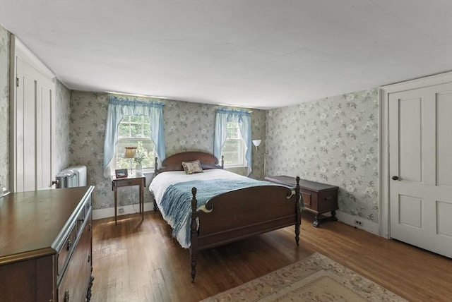 38 Booth Hill Rd, Scituate, MA 02066 - bedroom featuring wood finished floors, wallpapered walls, and radiator