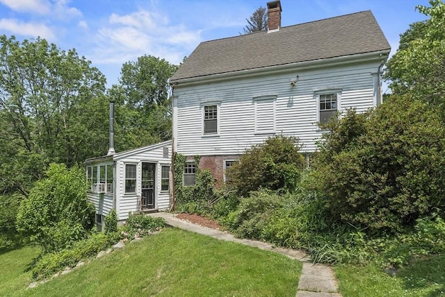 38 Booth Hill Rd, Scituate, MA 02066 - rear view of house with a chimney, a yard, and roof with shingles