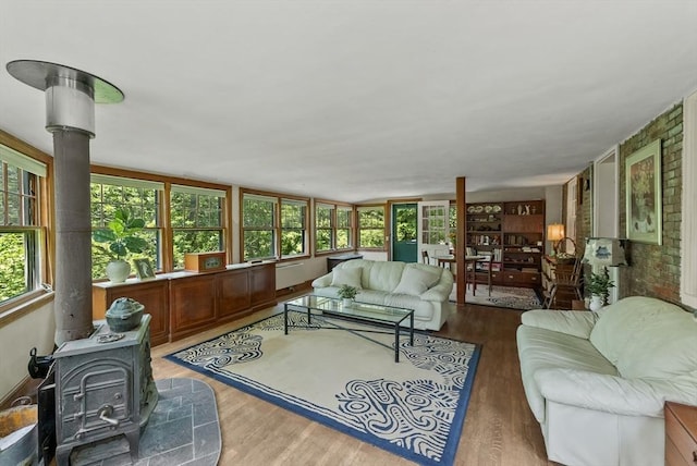 38 Booth Hill Rd, Scituate, MA 02066 - living room featuring a wood stove, wood finished floors, and plenty of natural light
