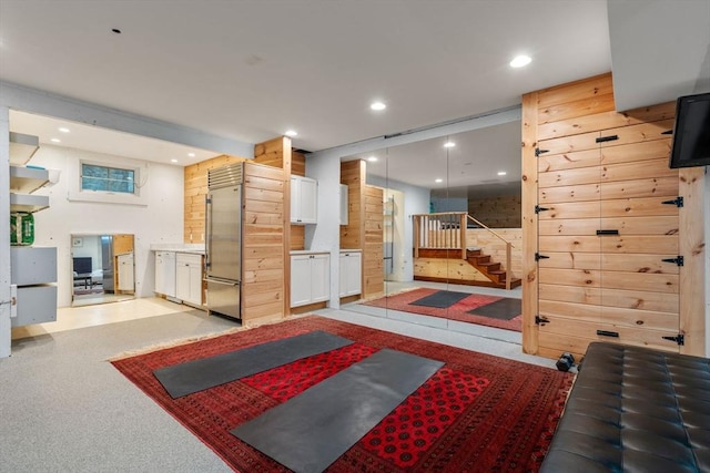 lobby featuring stairs and recessed lighting