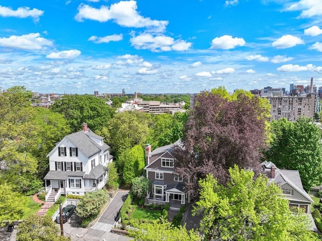 view of urban area featuring a tree filled landscape