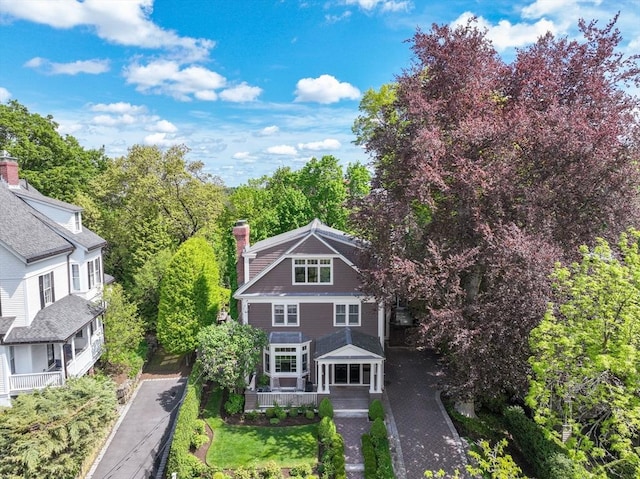 view of front of home featuring a chimney
