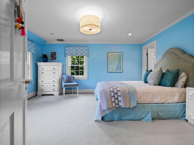 bedroom with ornamental molding, carpet, and baseboards