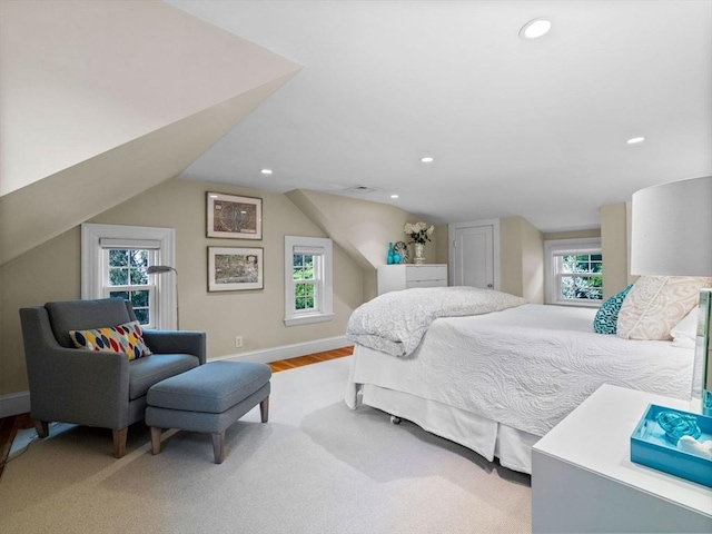 bedroom featuring lofted ceiling, recessed lighting, light wood finished floors, and baseboards