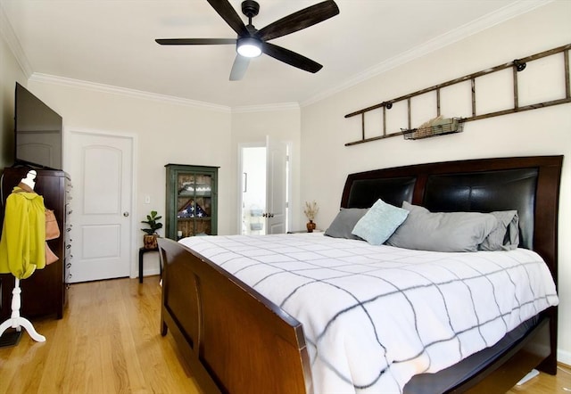 bedroom featuring ceiling fan, light wood-style floors, and ornamental molding