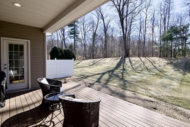 wooden terrace with fence and an outdoor fire pit