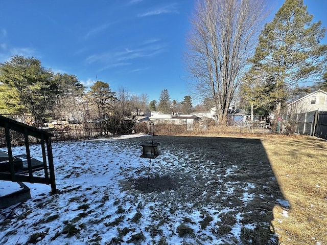 view of yard layered in snow