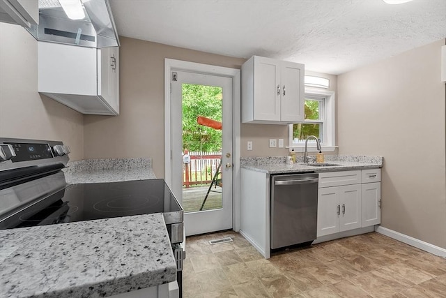 12 Allen Ct Unit 12, Northborough, MA 01532 - kitchen with appliances with stainless steel finishes, a sink, white cabinetry, and plenty of natural light