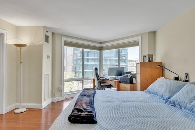 75-83 Cambridge Pkwy Unit W403, Cambridge, MA 02142 - bedroom featuring wood finished floors and baseboards