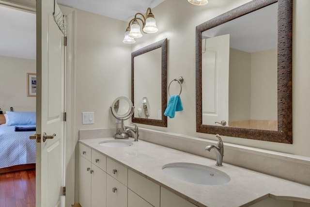 75-83 Cambridge Pkwy Unit W403, Cambridge, MA 02142 - ensuite bathroom with double vanity and wood finished floors