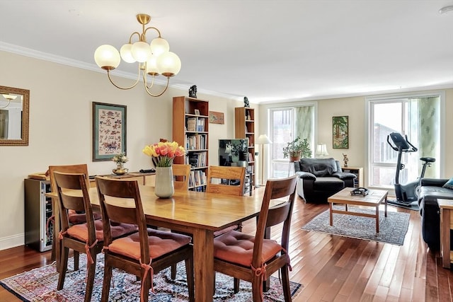 75-83 Cambridge Pkwy Unit W403, Cambridge, MA 02142 - dining space featuring a chandelier, dark wood finished floors, crown molding, and baseboards