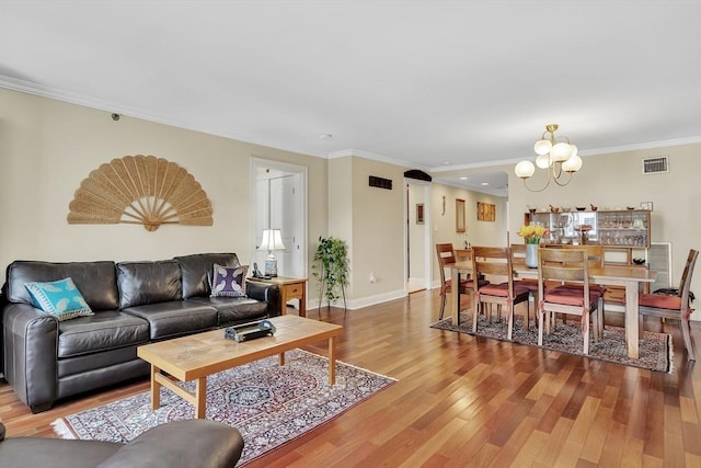 75-83 Cambridge Pkwy Unit W403, Cambridge, MA 02142 - living area featuring a chandelier, wood finished floors, ornamental molding, recessed lighting, and baseboards
