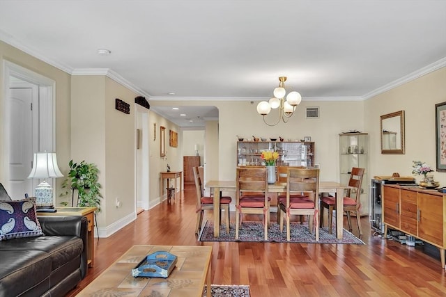 75-83 Cambridge Pkwy Unit W403, Cambridge, MA 02142 - dining room with a chandelier, wood finished floors, ornamental molding, and baseboards