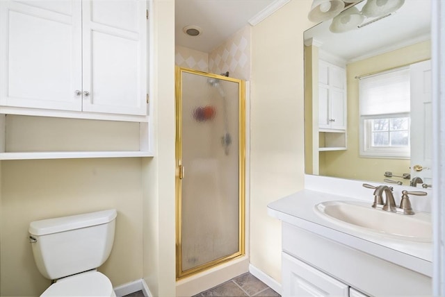 bathroom featuring vanity, crown molding, toilet, and walk in shower