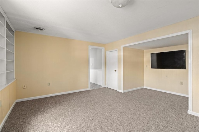 unfurnished room featuring carpet flooring