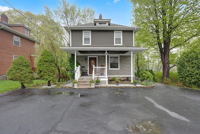 traditional style home featuring a porch
